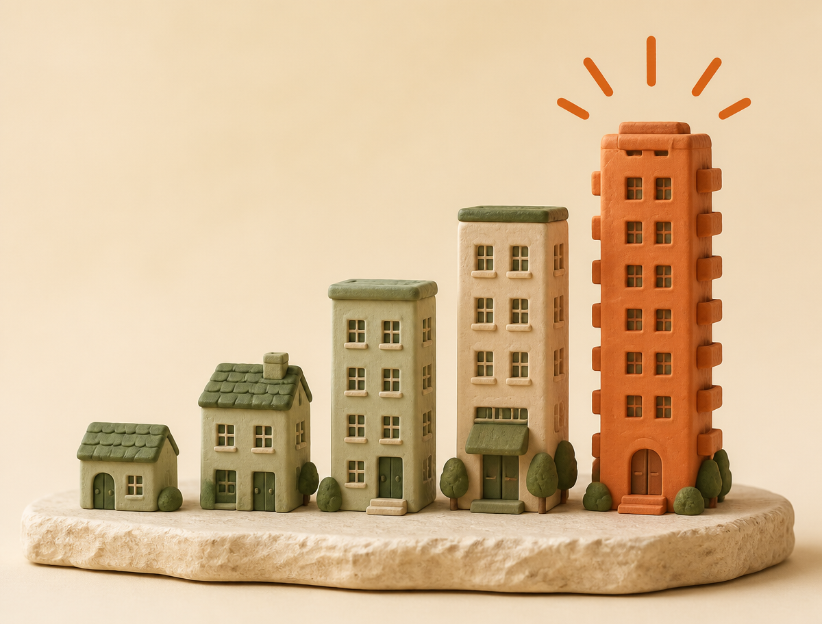 Five clay buildings rising from a shared foundation